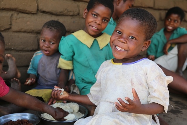 Not a mango anymore. Gertrude is now enjoying Nsima/Photo: Charles Kabena/World Vision.